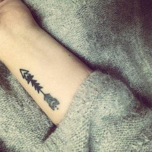 Meaningful arrow tattoo