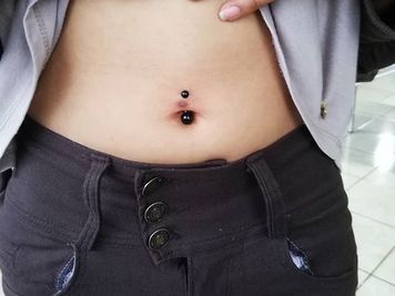 belly button piercing cost