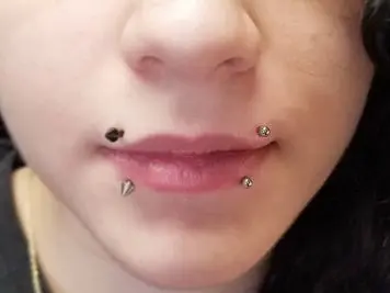 canine bites lip piercing