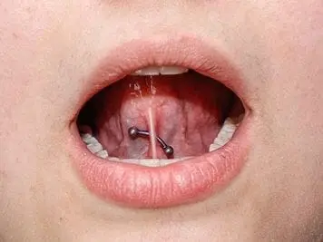 curved barbell tongue web piercing