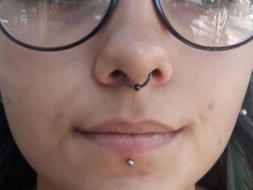 cute septum and labret piercing