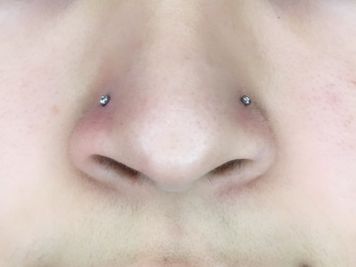 double nose piercing both sides