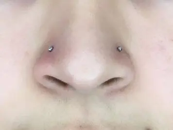 double nose piercing both sides