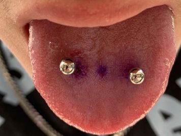 double tongue piercing called