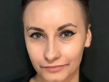 eyebrow and dahlia piercing
