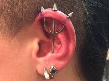 infected trident piercing