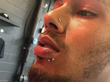 men spider bites lip piercing