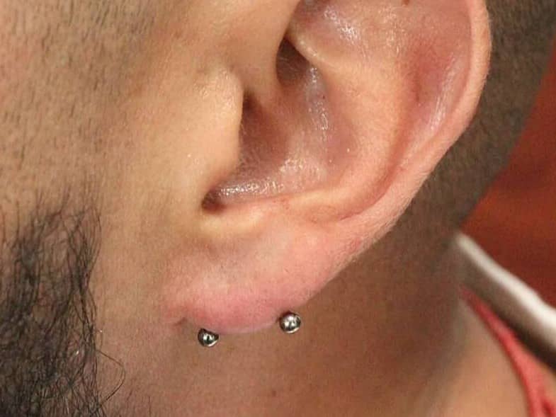 men ear piercing