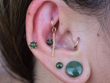 rook and tragus piercing