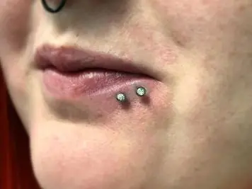 spider bites lip piercing