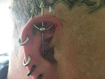 trident piercing on ear