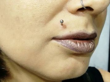 women nose ring and madonna piercing